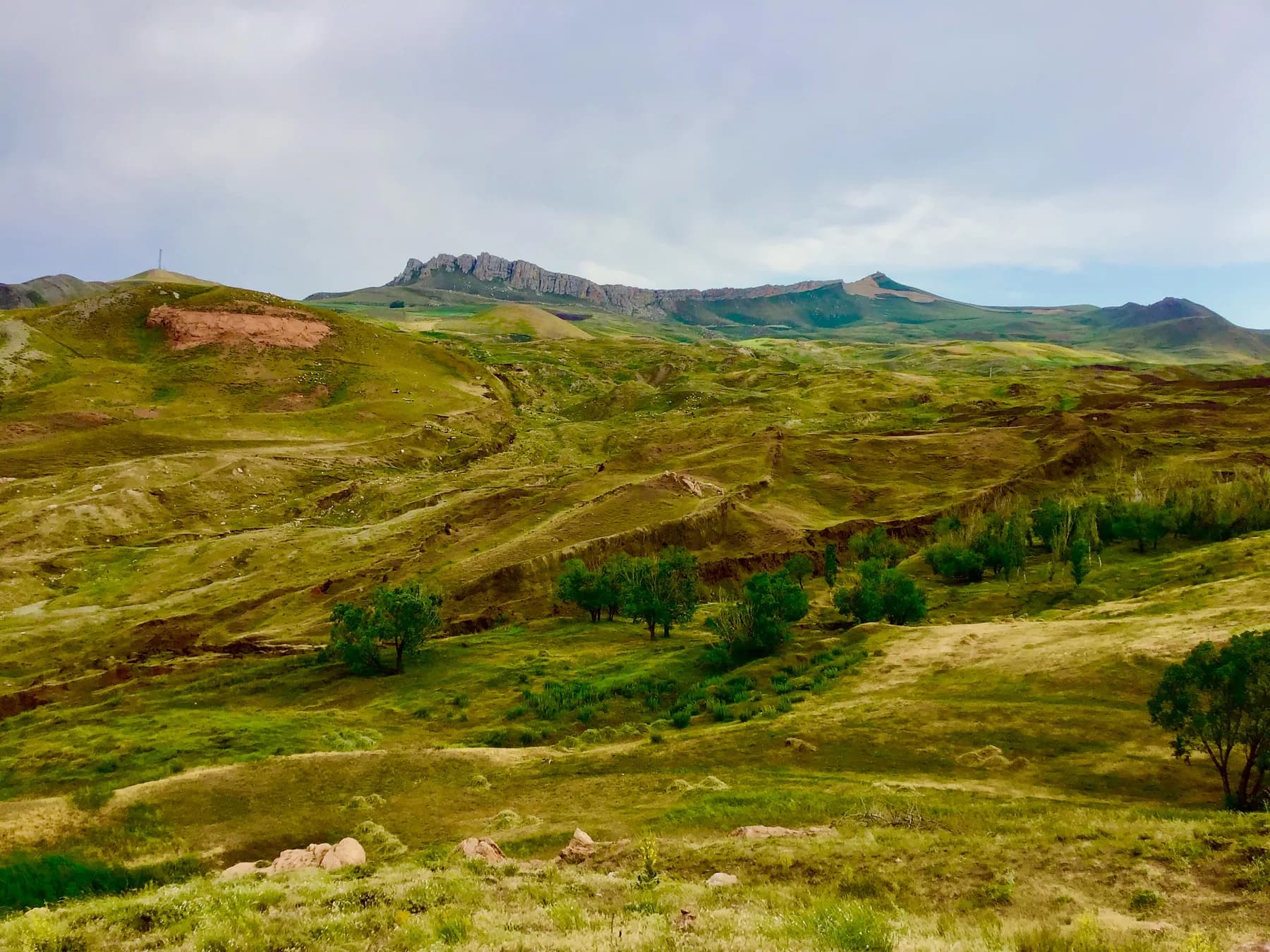 Green summer slopes around Durupınar seen from the visitor centre bluff